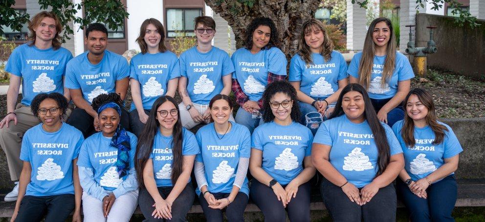 IC Student Staff - 2023-2024 - 11 students wearing blue Diversity Rocks shirts in Ferrogiaro Quad